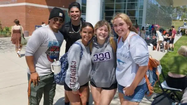 students posing together outside